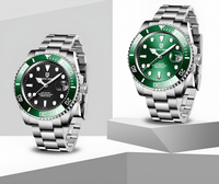 Thumbnail for Two watches with green faces and silver bracelets on a gray background