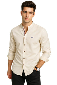 Thumbnail for Man wearing a beige button-up shirt with a small logo on a white background