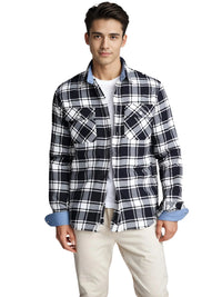 Thumbnail for Man wearing a black and white plaid shirt with rolled-up sleeves on a white background