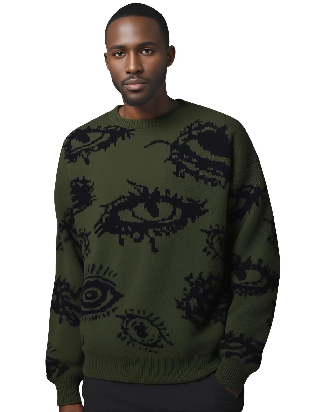 Man wearing a green sweater with black abstract patterns on a white background