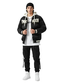 Thumbnail for Person wearing a black varsity jacket with white lettering, white t-shirt, black pants, and white sneakers on a white background.