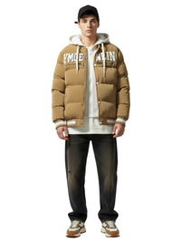 Thumbnail for Man wearing a brown puffer jacket with visible branding on a white background