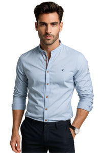 Thumbnail for Man wearing a light blue button-up shirt with a white background