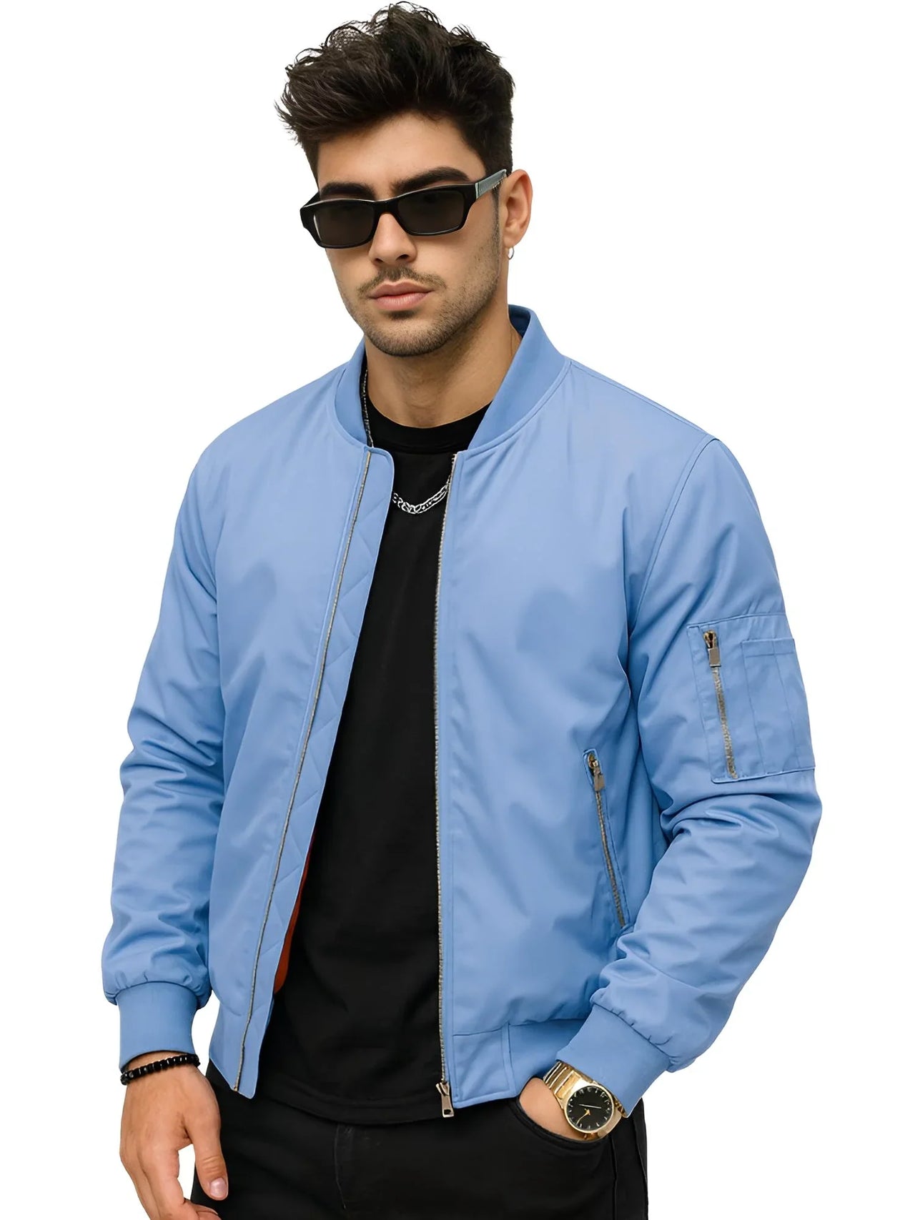 Man wearing a light blue bomber jacket and sunglasses on a white background