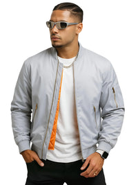 Thumbnail for Man wearing a light gray bomber jacket with orange lining, white shirt, and sunglasses on a white background