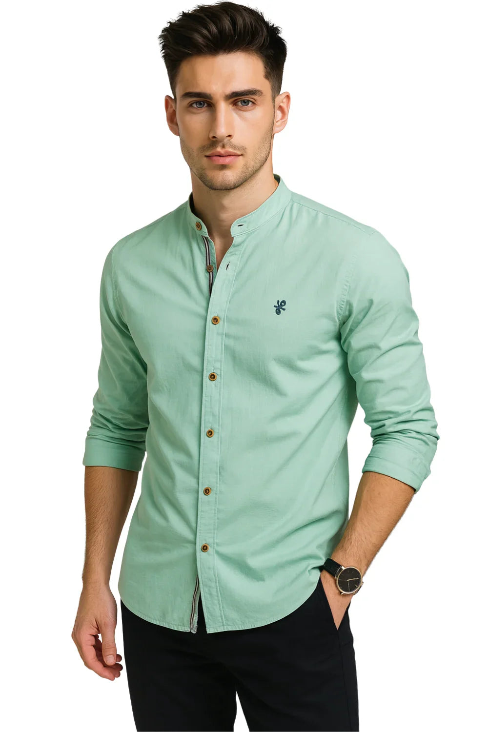 Man wearing a light green button-up shirt with a white background