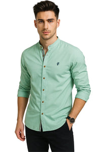 Thumbnail for Man wearing a light green button-up shirt with a white background