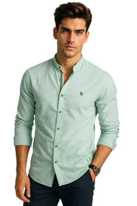 Thumbnail for Man wearing a light green button-up shirt with a small logo on a white background
