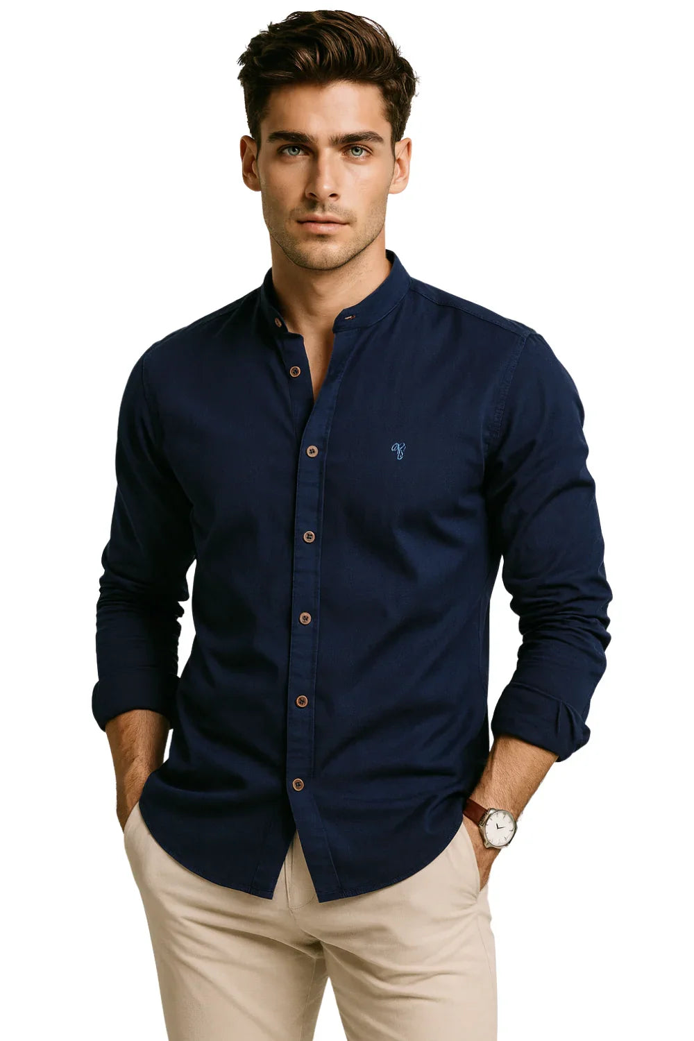 Man wearing a navy button-up shirt and beige pants on a white background