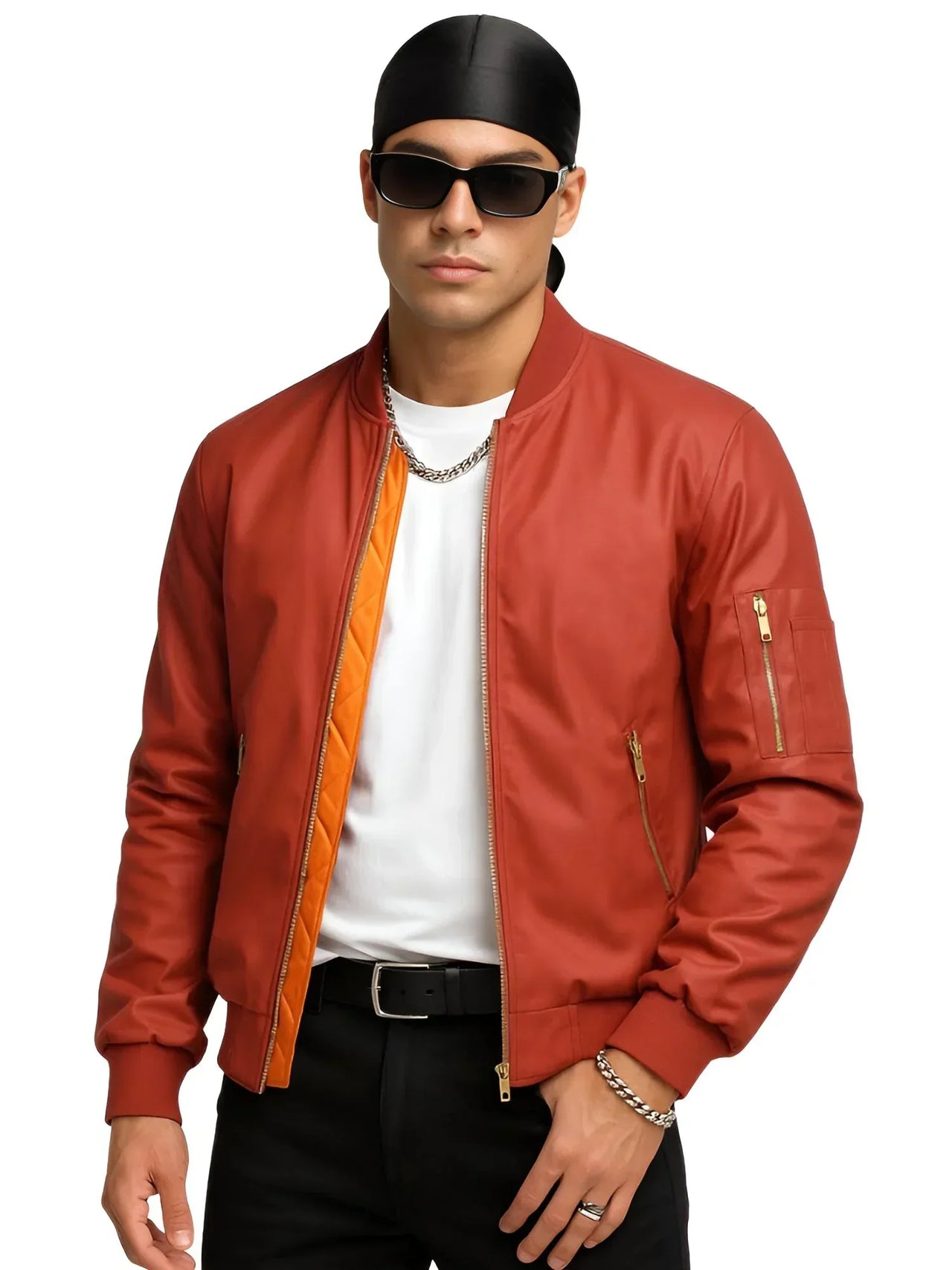 Man wearing an orange bomber jacket with orange lining, black pants, and sunglasses on a white background