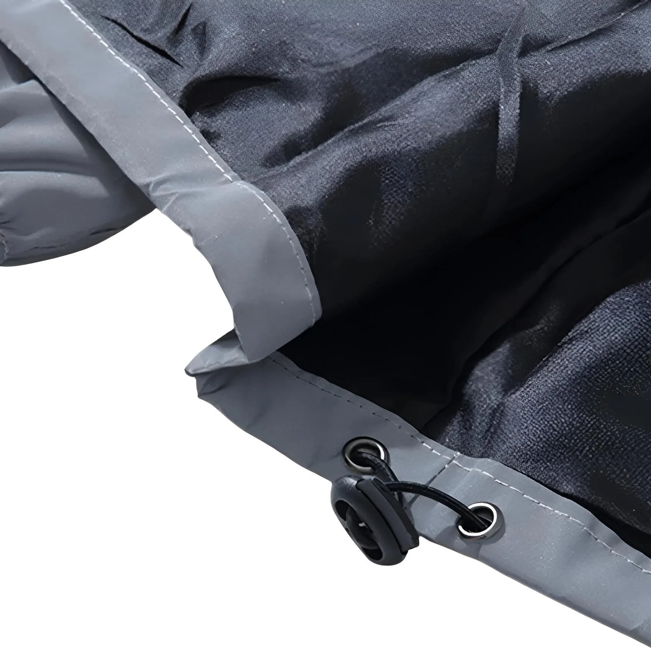 Close-up of a gray reflective jacket with black interior on a white background