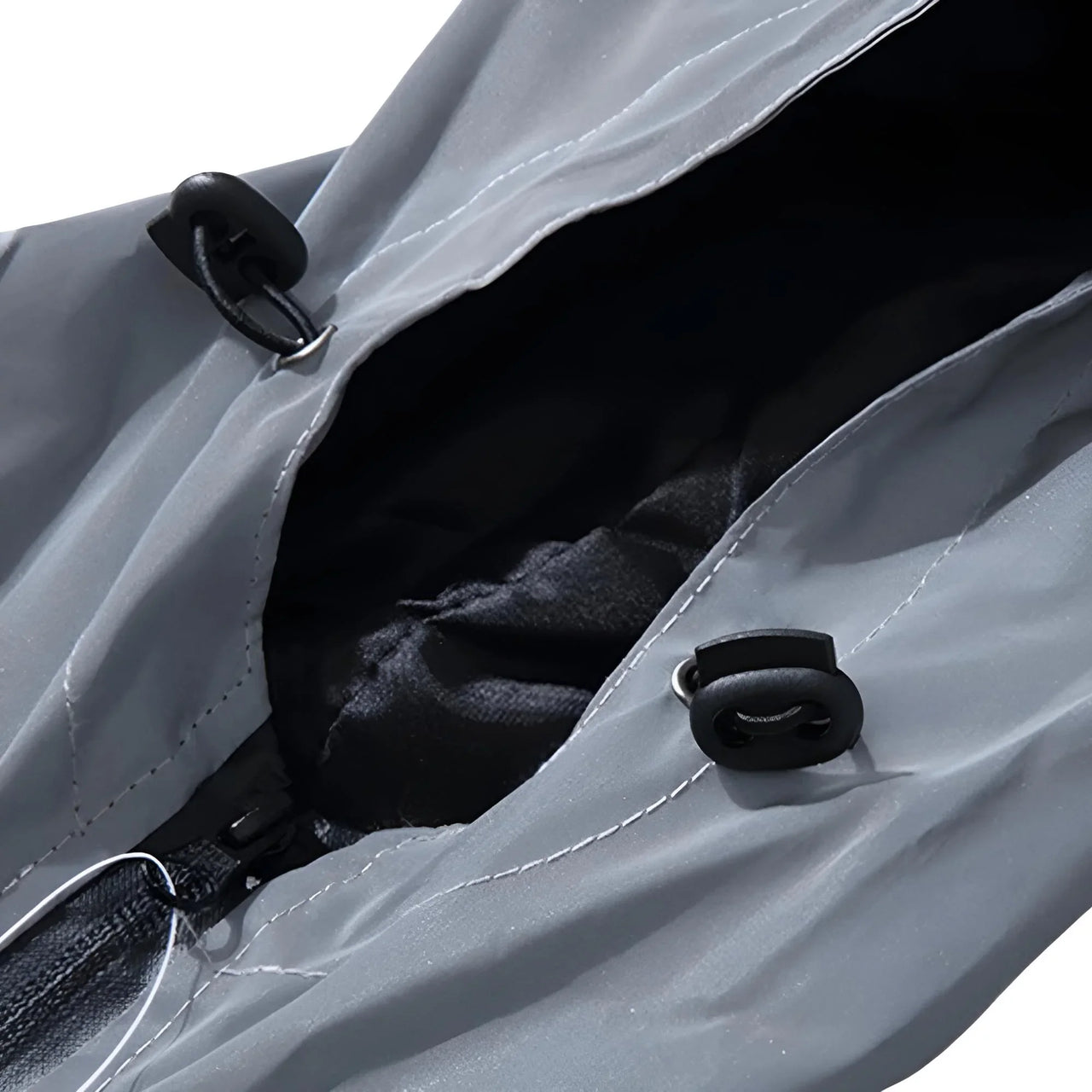 Men's gray reflective jacket with black straps on a white background