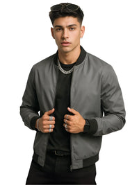 Thumbnail for Man wearing a gray bomber jacket over a black shirt on a white background