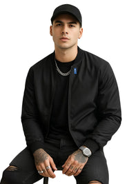 Thumbnail for Man wearing a black jacket and cap on a white background