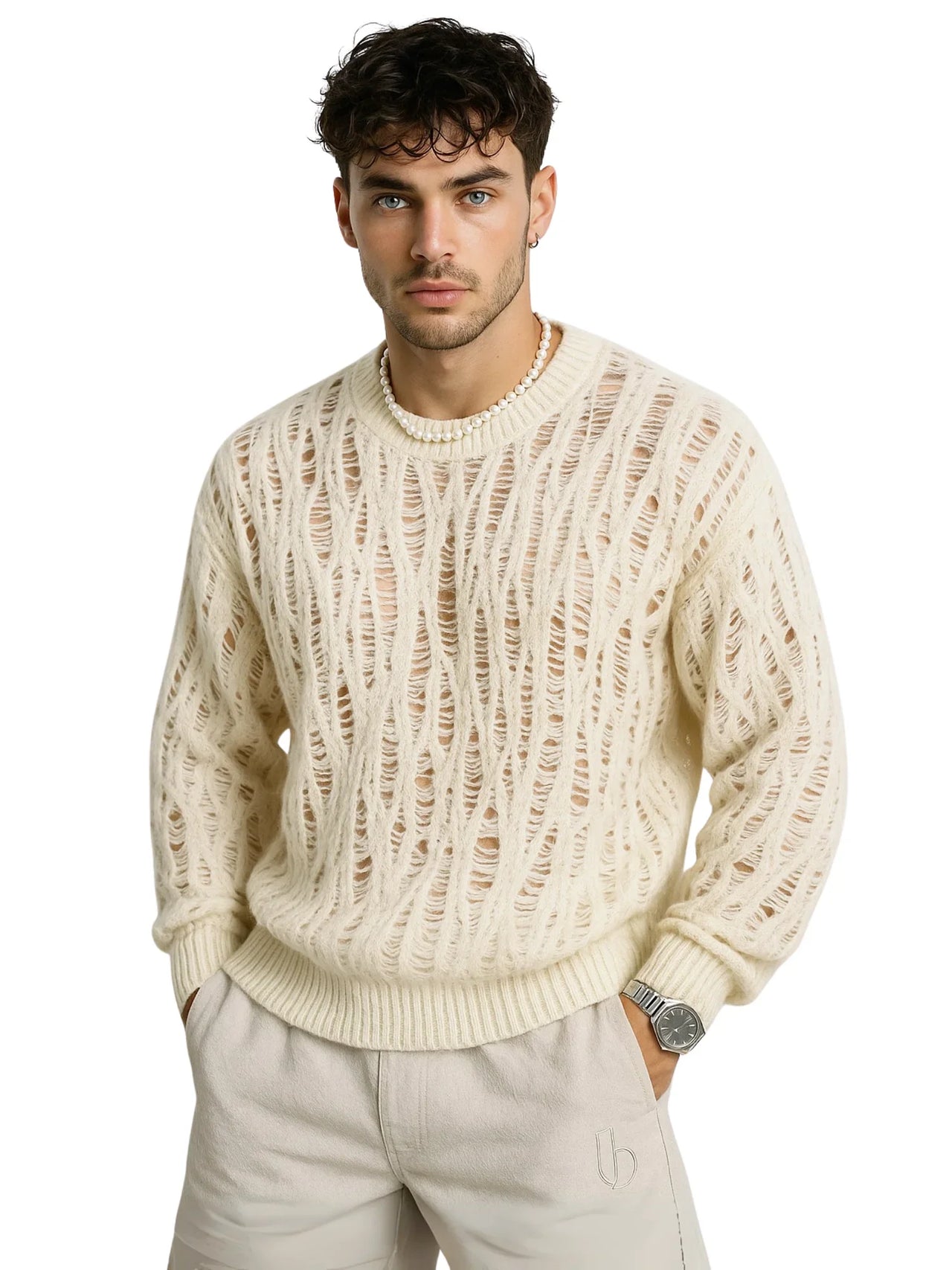 Man wearing a white distressed sweater and light-colored pants on a white background