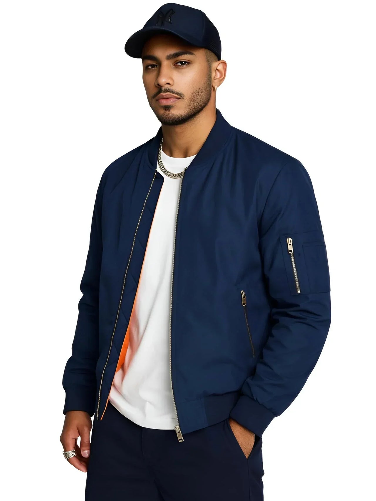 Man wearing a navy bomber jacket and cap on a white background