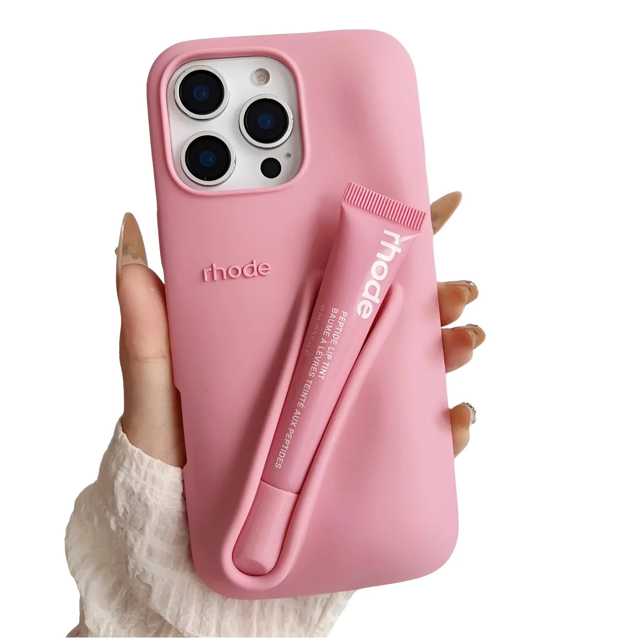 Pink silicone lipstick iPhone case with a matching lip balm held by a hand on a white background