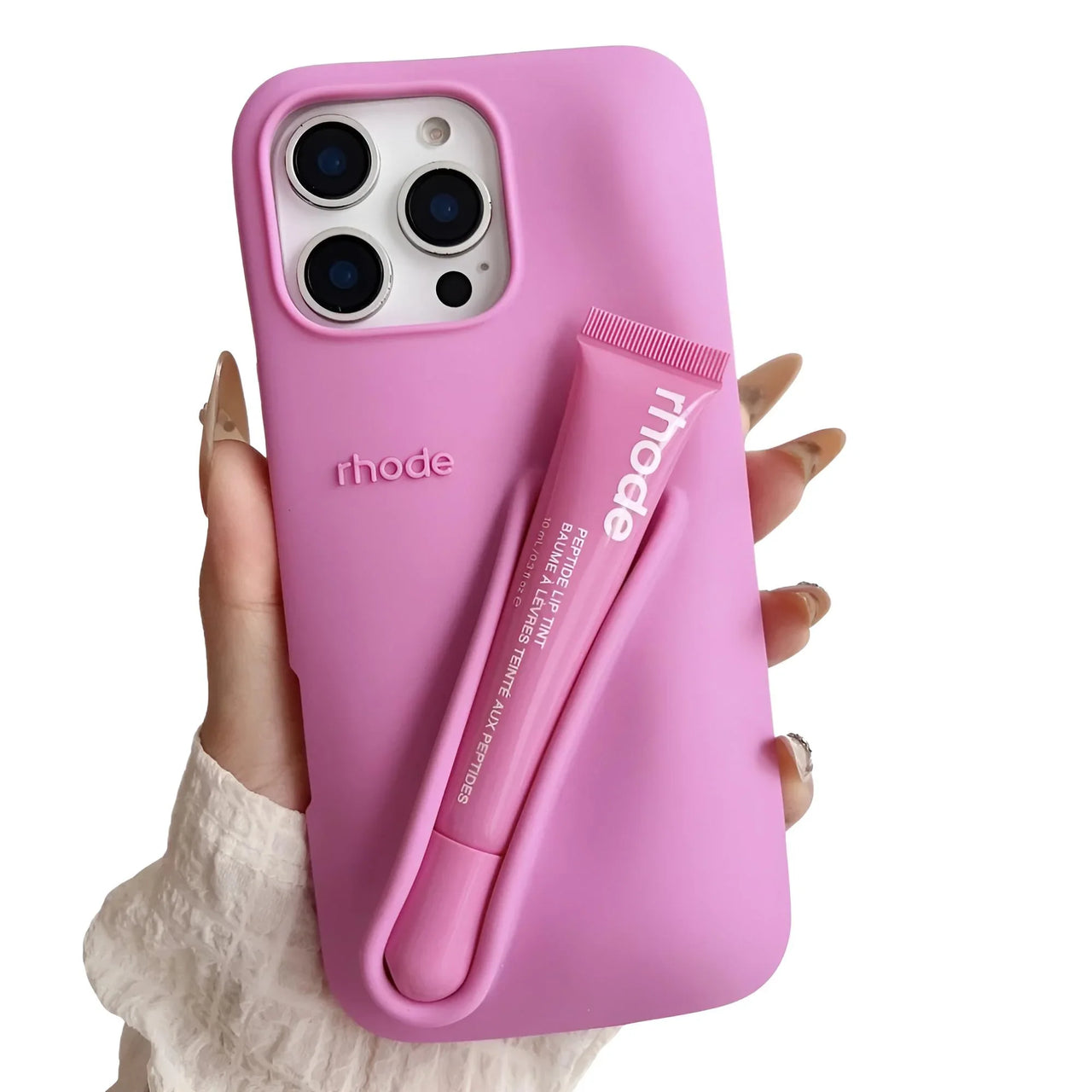 Pink silicone lipstick iPhone case with Rhode branding held by a hand on a white background