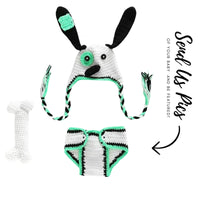 Thumbnail for Crocheted dog-themed baby hat and diaper set with green accents on a white background.