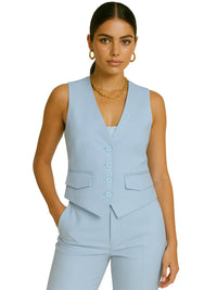 Thumbnail for Woman wearing a light blue vest and pants set on a white background
