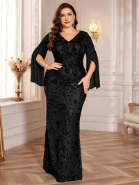 Thumbnail for Woman wearing a black plus size evening gown with sequin details in an elegant room.