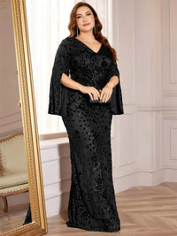 Thumbnail for Plus size woman in a black sequin maxi dress standing in front of a mirror.