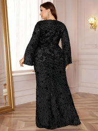 Thumbnail for Woman wearing a black plus size evening gown with sequin details in an elegant room.