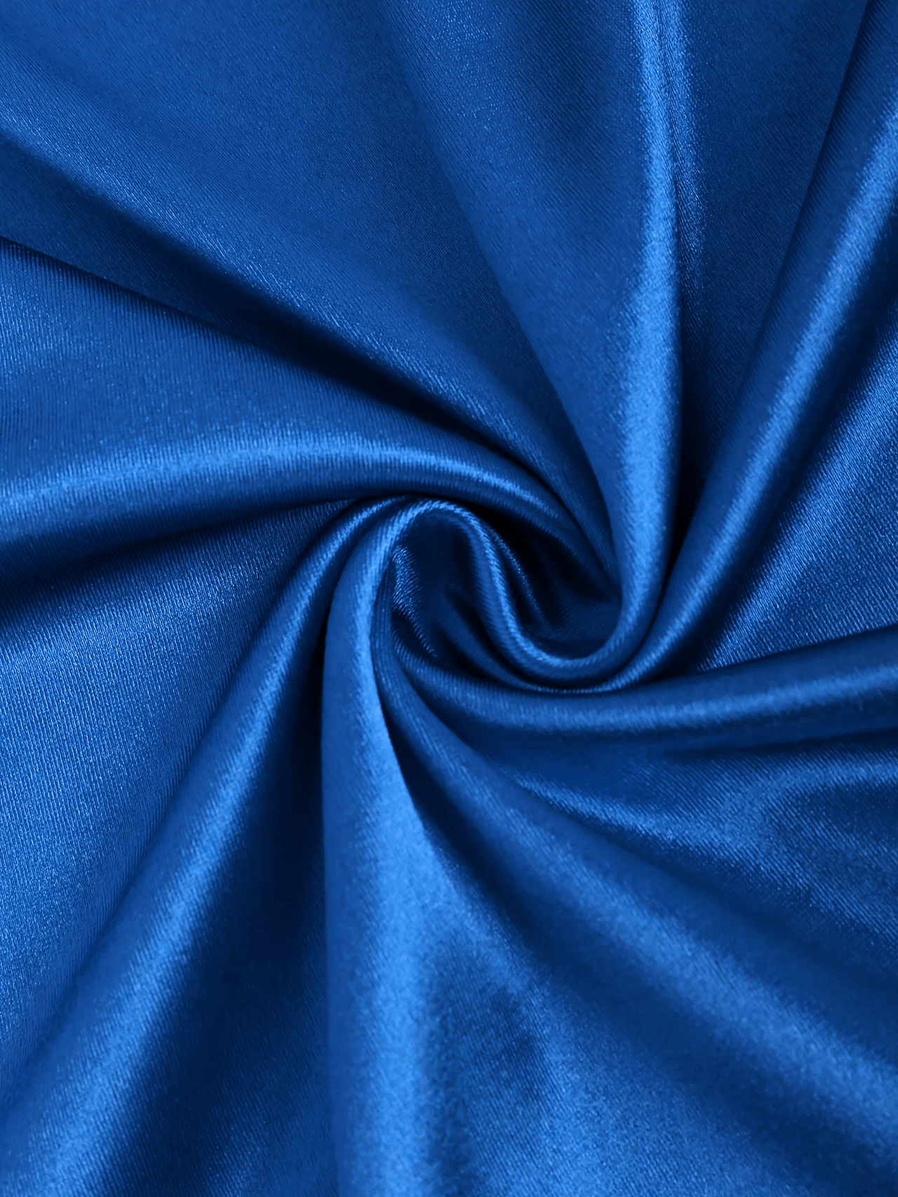 Close-up of blue satin fabric with a swirl pattern