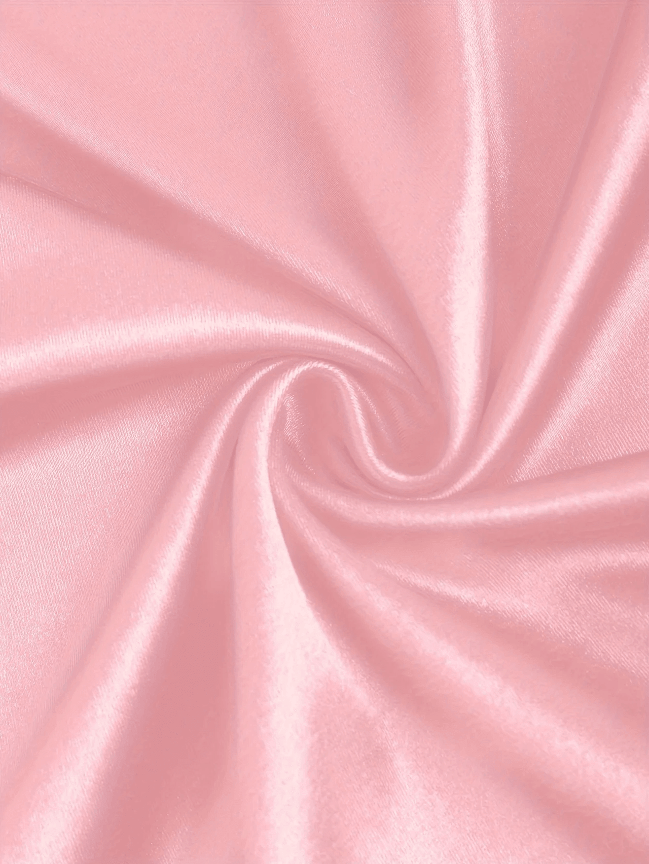 Close-up of pink satin fabric with a swirl pattern