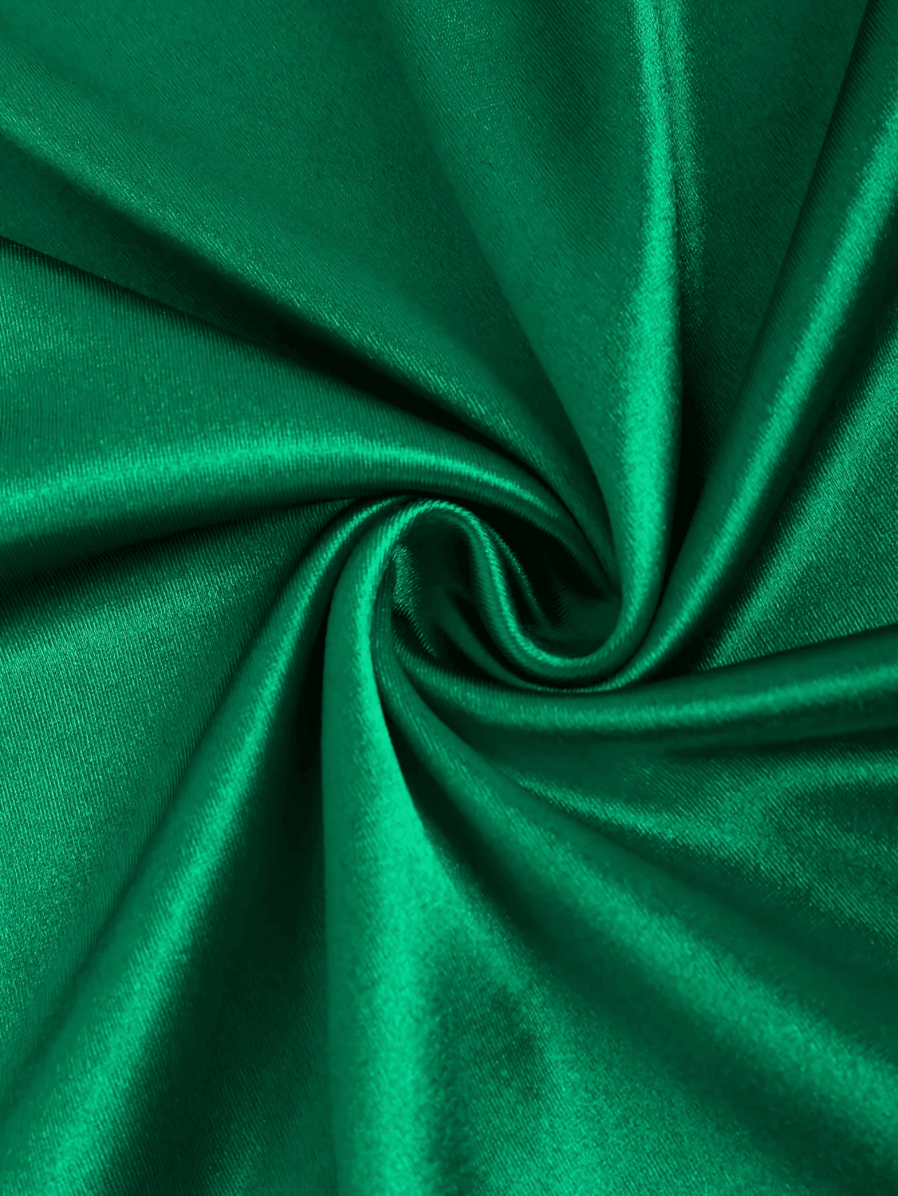 Close-up of green fabric with a swirl pattern
