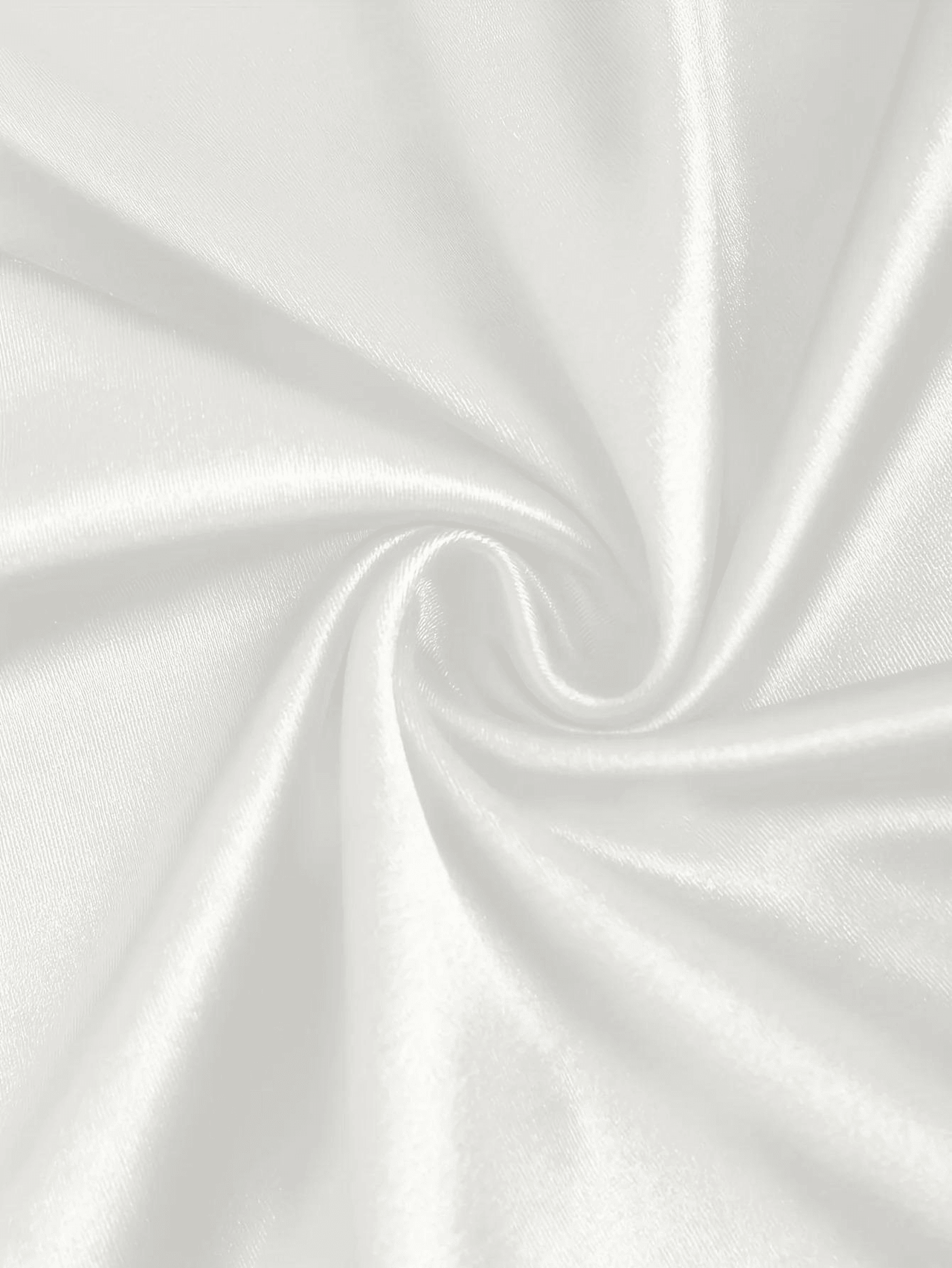 Close-up of white satin fabric with a subtle wave pattern