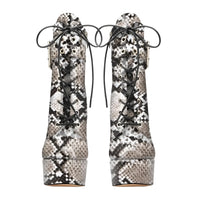 Thumbnail for Pair of snake print high-heeled boots with black laces on a white background