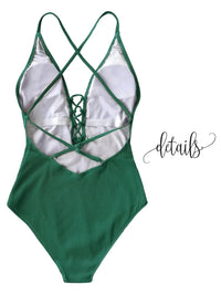 Thumbnail for Green ribbed swimsuit with criss-cross straps on a white background