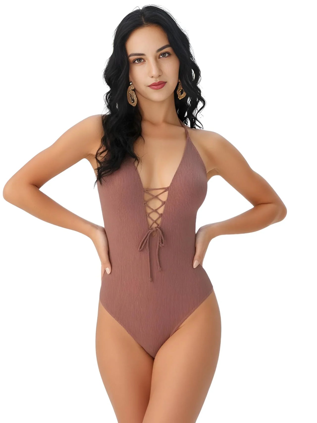 Woman wearing a brown swimsuit with a plunging neckline on a white background
