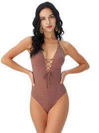 Thumbnail for Woman wearing a brown swimsuit with a plunging neckline on a white background