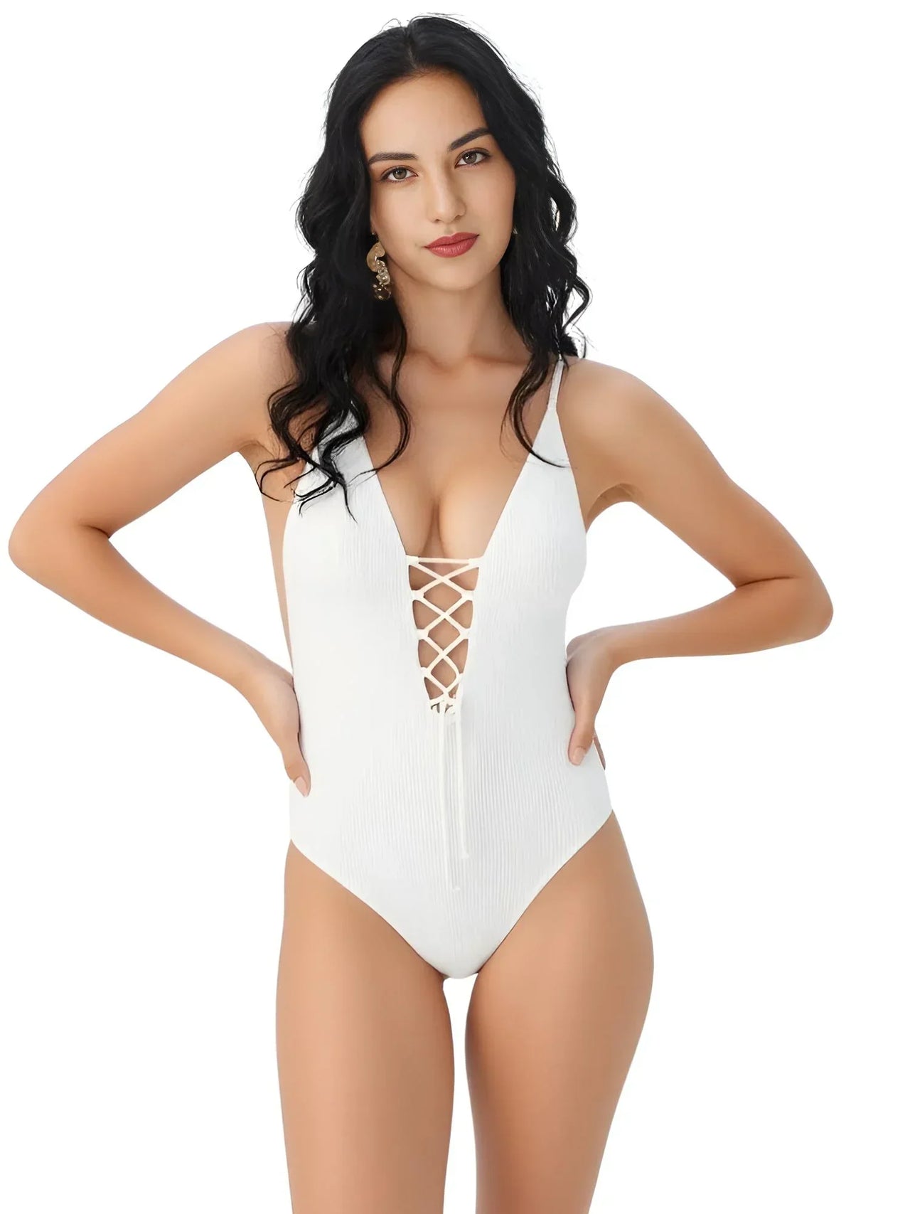 Woman wearing a white swimsuit with a criss-cross design on a white background