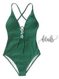 Thumbnail for Green ribbed swimsuit with criss-cross straps on a white background