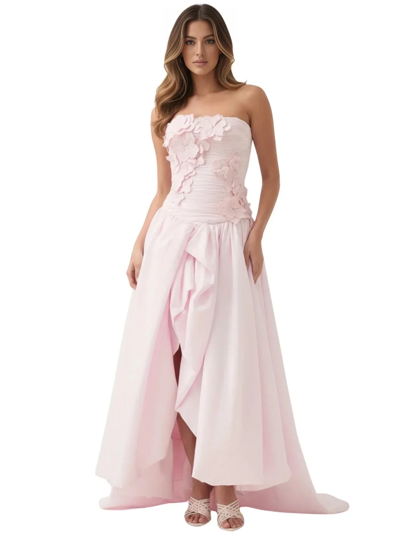 Woman wearing a pink long bubble dress with a high slit on a white background