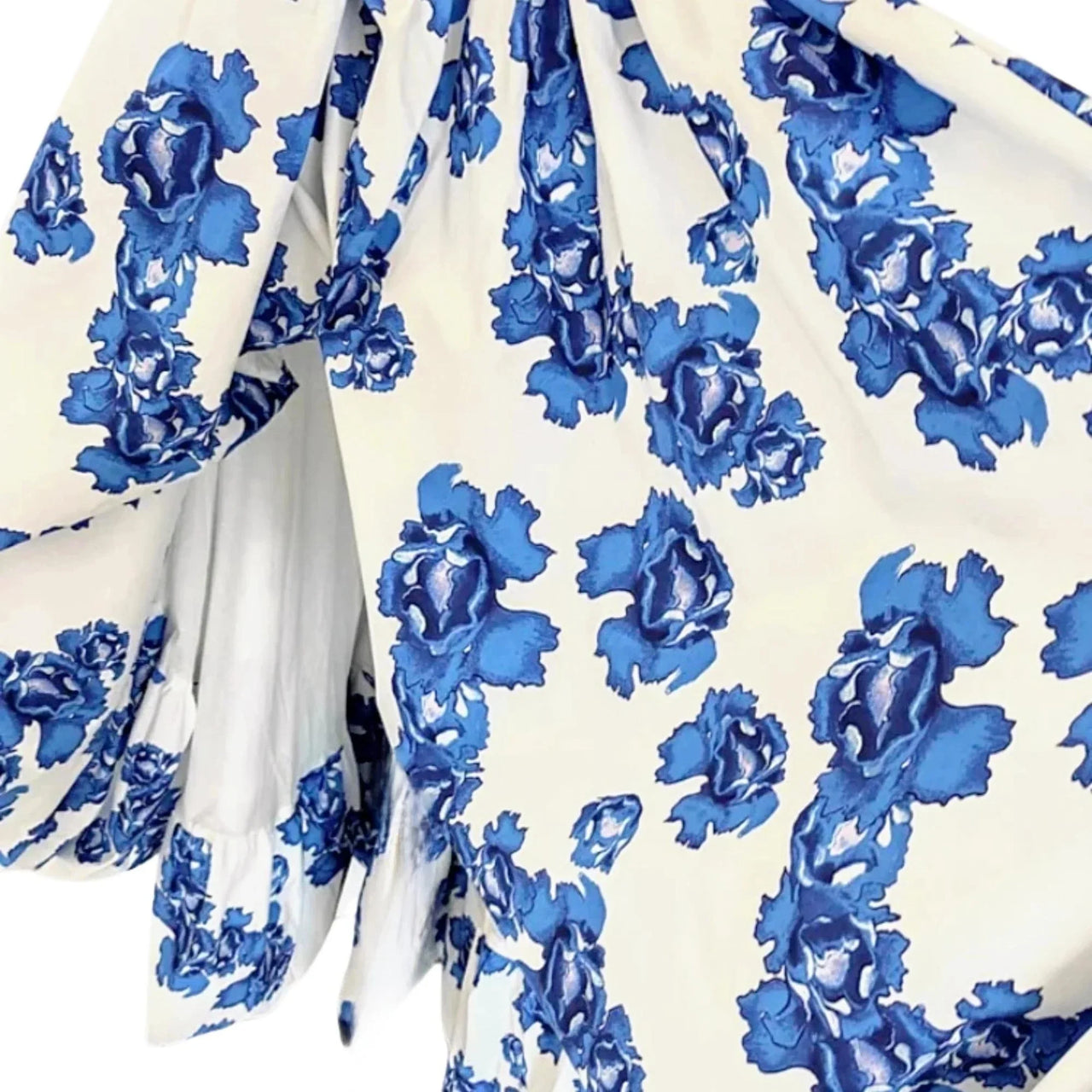 Blue floral pattern on a white fabric background