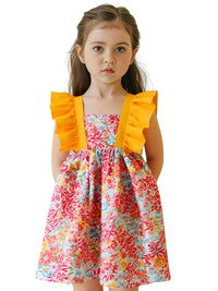 Thumbnail for Young girl wearing a colorful floral dress with yellow ruffled sleeves on a white background