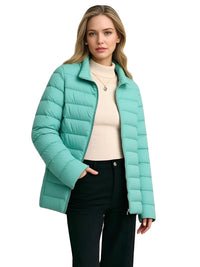 Thumbnail for Woman wearing a sky blue puffer jacket on a white background