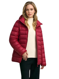 Thumbnail for Woman wearing a red puffer jacket on a white background