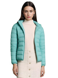 Thumbnail for Woman wearing a teal puffer jacket on a white background