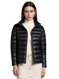 Thumbnail for Woman wearing a black puffer duck down jacket on a white background