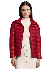 Thumbnail for Woman wearing a dark red duck down jacket on a white background
