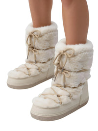 Thumbnail for White winter boots with fur lining worn by a person on a white background