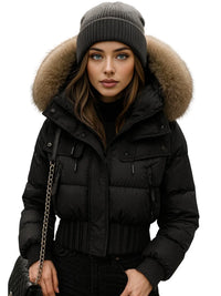Thumbnail for Woman wearing a black puffer jacket with a fur-lined hood on a white background