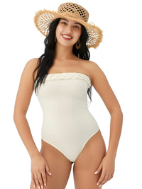 Thumbnail for Woman wearing a white strapless swimsuit and straw hat on a white background