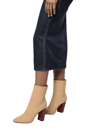 Thumbnail for Apricot ankle sock boots with brown block heels worn with a dark denim skirt on a white background