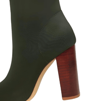 Thumbnail for Olive green ankle sock boot with a wooden heel on a white background